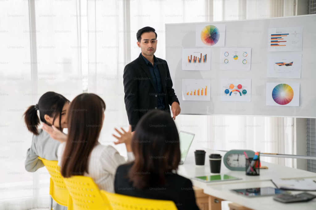 A man's presentation on data and charts