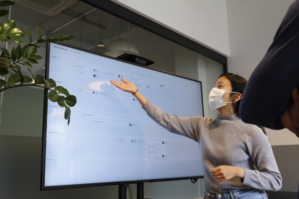 A lady giving a presentation on the Voom video app